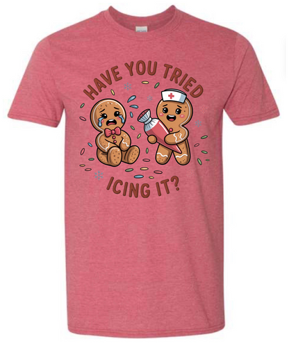 Red t-shirt with cartoon gingerbread men and text on a white background